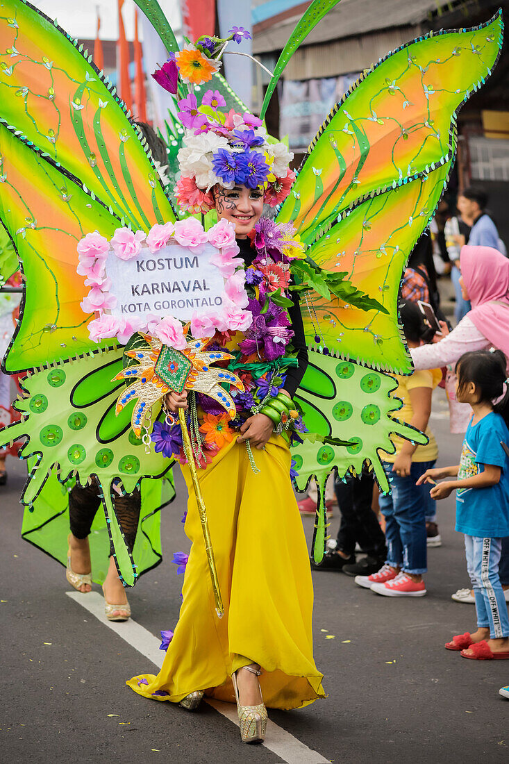 Girl in elaborate butterfly costume at the annual Tomohon International Flower Festival parade, Tomohon, North Sulawesi, Sulawesi, Indonesia, Southeast Asia, Asia