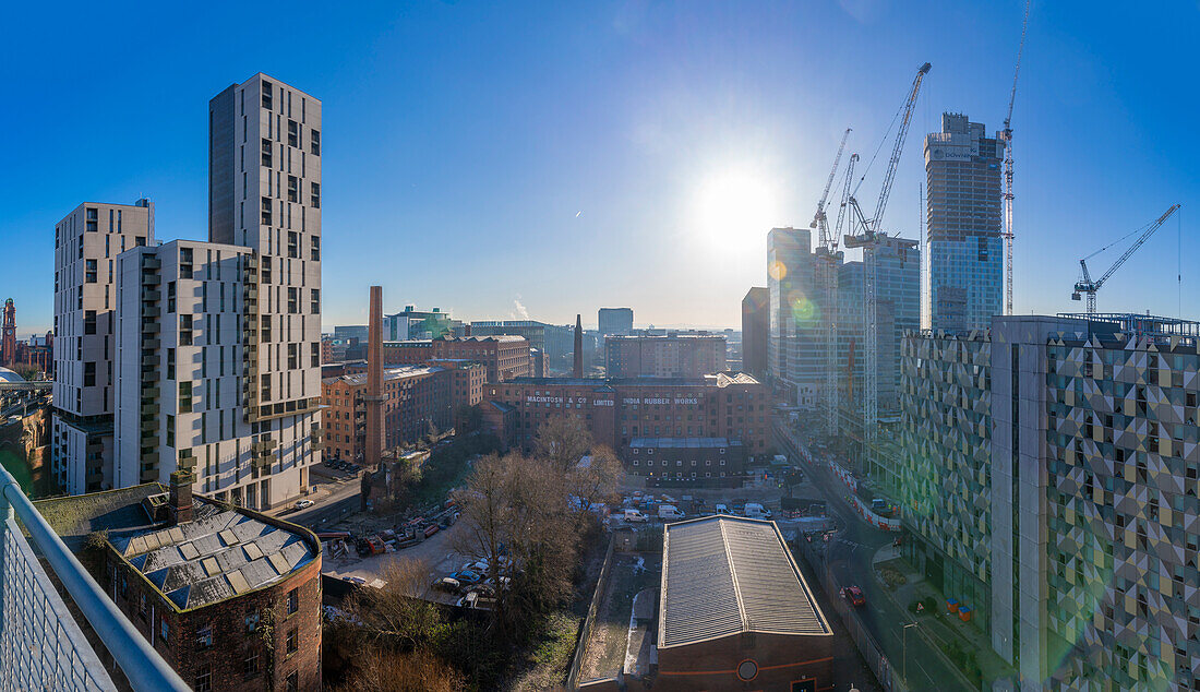 Elevated view of city skyline and cranes from Tony Wilson Place, Manchester, Lancashire, England, United Kingdom, Europe