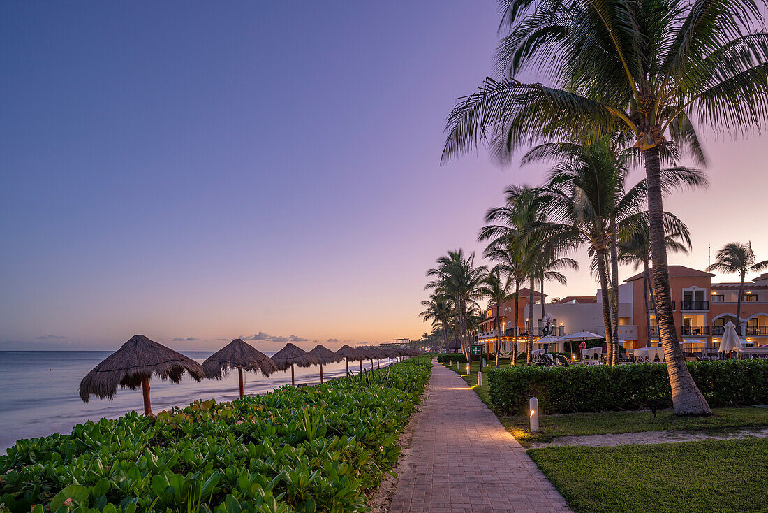 View of hotel and beach at dusk near Puerto Morelos, Quintana Roo, Caribbean Coast, Yucatan Peninsula, Riviera Maya, Mexico, North America