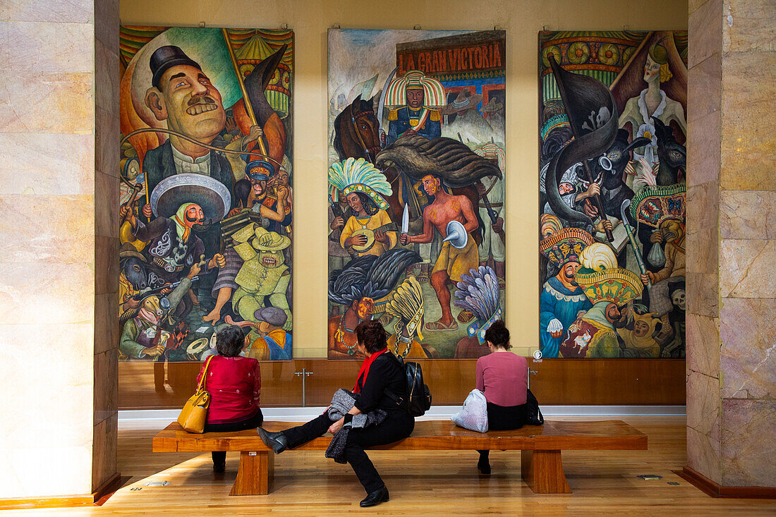 Tourists viewing frescoes by Diego Rivera, Palacio de Bellas Artes (Palace of Fine Arts), UNESCO World Heritage Site, Mexico City, Mexico, North America