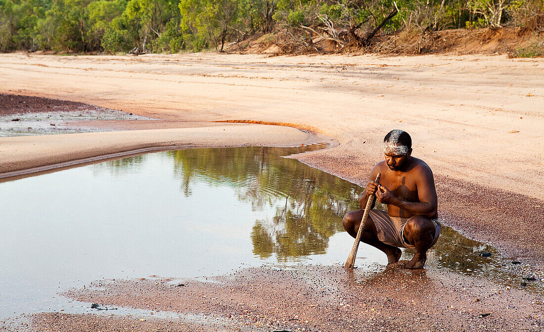 Aboriginal Yolngu man with tribal clay paint used for Welcome to Country, at Nyinyikay Homeland, East Arnhem Land, Northern Territory, Australia, Pacific