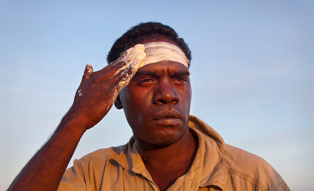 Aboriginal Yolngu man with tribal paint, often used when performing cultural dances and welcome ceremonies, Nyinyikay Homeland, East Arnhem LandNorthern Territory, Australia, Pacific