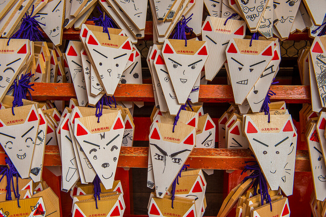 Wooden souvenir plaques at the Endless Red Gates of Kyoto's Fushimi Inari, Kyoto, Honshu, Japan, Asia