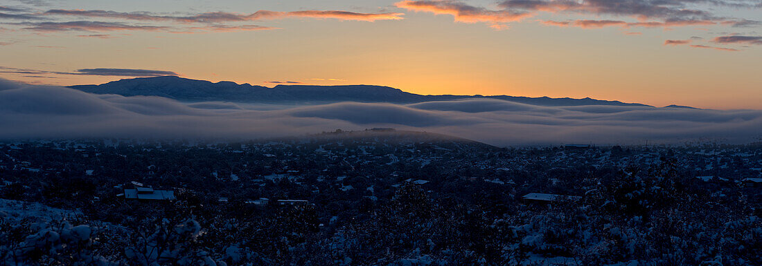 An ocean of fog rolling across the town of Chino Valley just as the sun is rising behind Mingus Mountain on a winter morning, Arizona, United States of America, North America