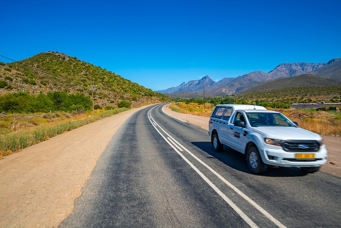 View of road R62 and green mountainous landscape between Zoar and Calitzdorp, South Africa, Africa