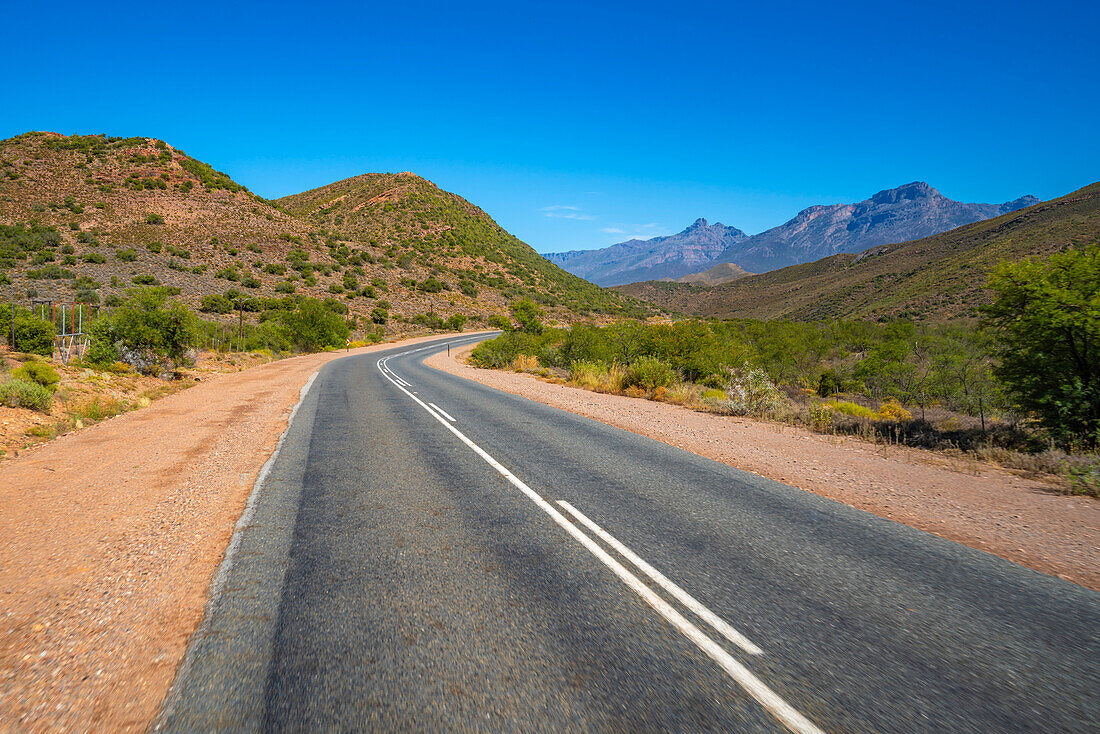 View of road R62 and green mountainous landscape between Zoar and Calitzdorp, South Africa, Africa