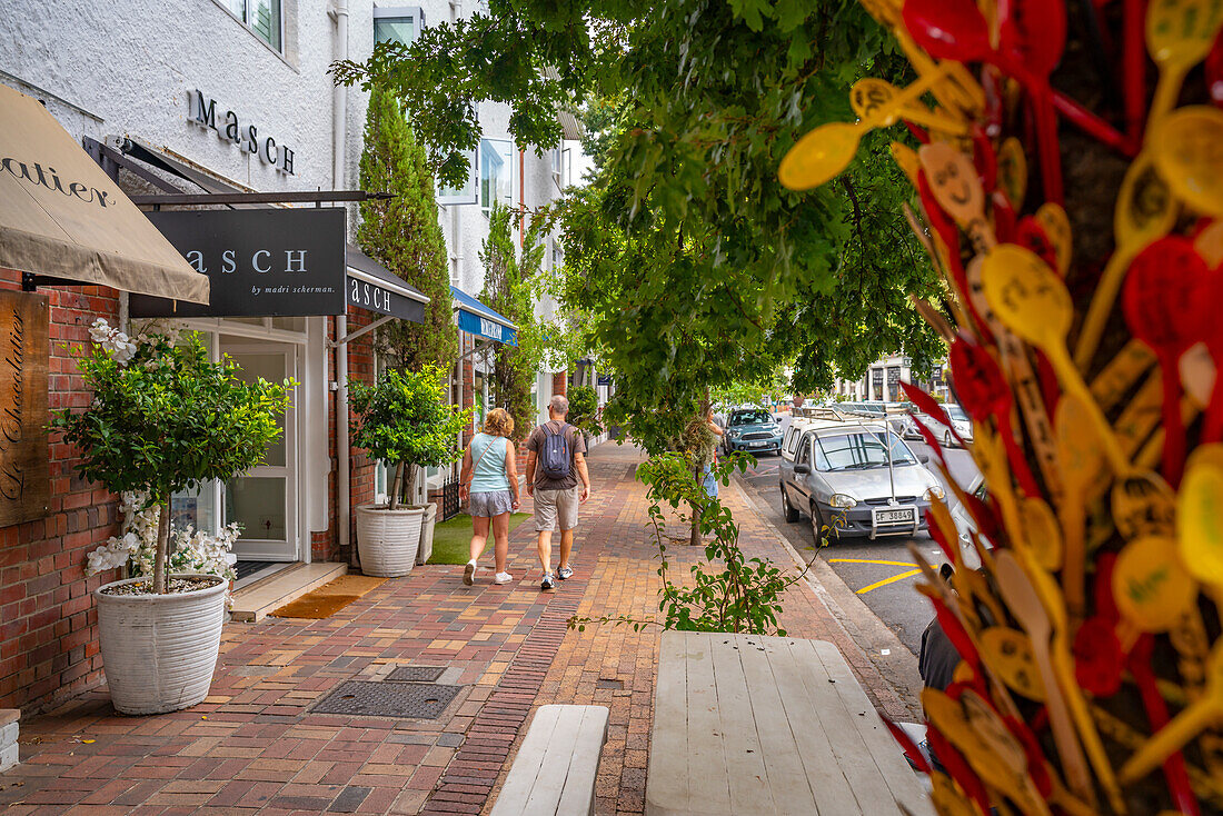 View of couple walking in street, Stellenbosch Central, Stellenbosch, Western Cape, South Africa, Africa