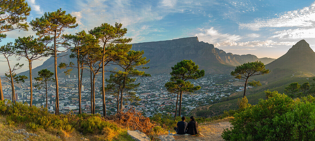 View of couple and Table Mountain from Signal Hill at sunset, Cape Town, Western Cape, South Africa, Africa