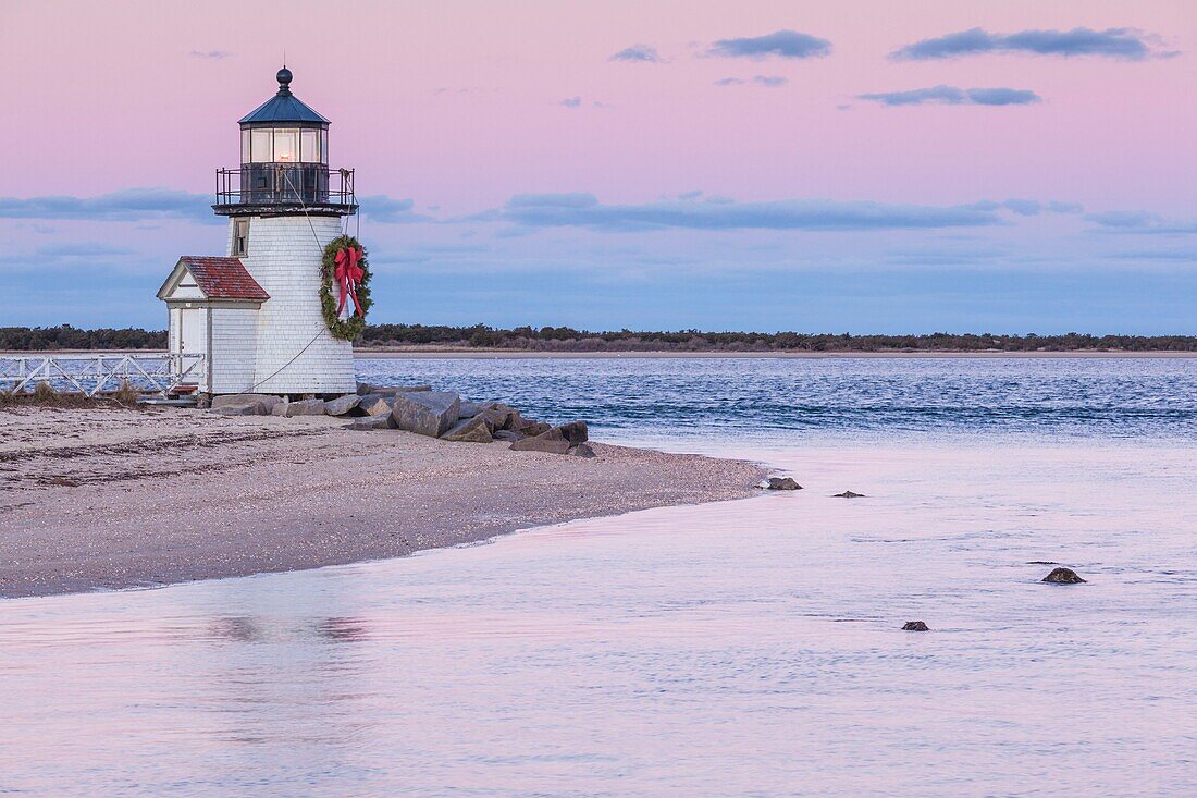 United States, New England, Massachusetts, Nantucket Island, Nantucket, Brant Point Lighthouse with a Christmas wreath, dusk