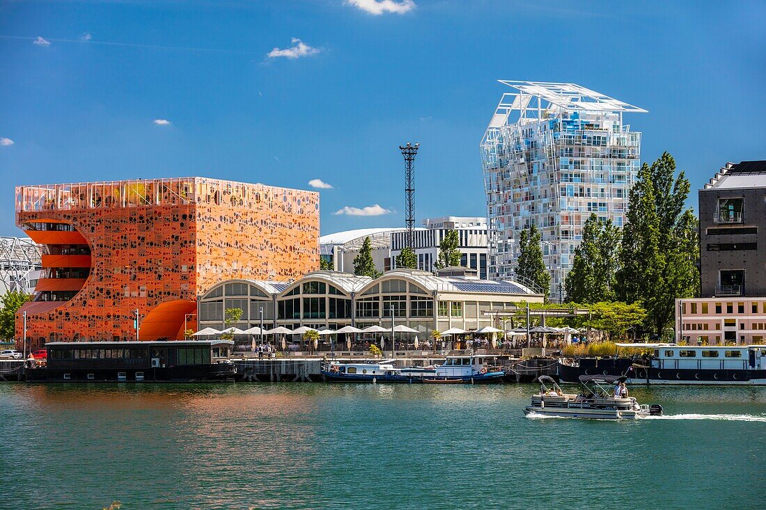 France, Rhone, Lyon, La Confluence district south of the Presqu'ile, close to the confluence of the Rhone and the Saone rivers, quai Rambaud along the former docks, Pavillon des Salins also called Cube Orange by the architects Dominique Jakob and Brendan Mac Farlane and Ycone residential building designed by architect Jean Nouvel