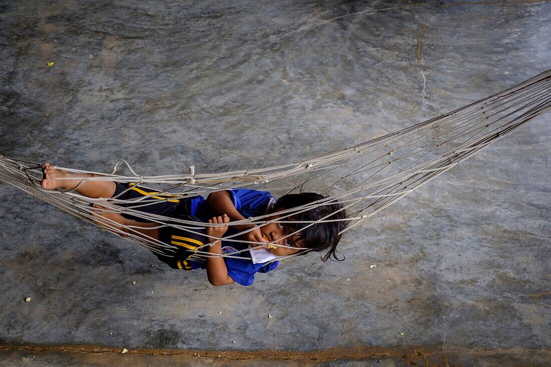 Cambodia, Banteay Chhmar, young girl in a hammock