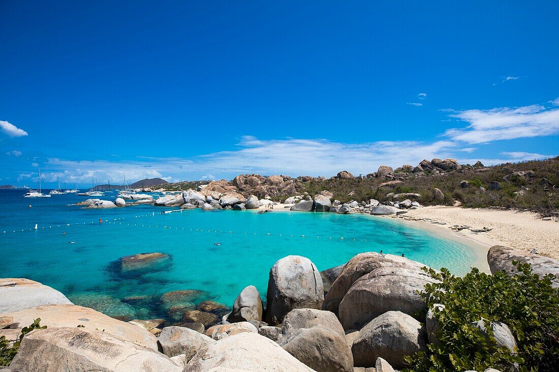 West Indies, British Virgin Islands, Virgin Gorda Island, The Baths, bathing beach view, sailboats at anchor, in the foreground the typical rocks that surround the paradisiacal swimming area