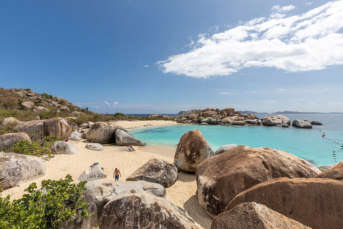 West Indies, British Virgin Islands, Virgin Gorda Island, The Baths, view of the bathing beach, sailboats and motor boat at anchor, in the foreground the typical rocks that surround the paradisiacal swimming area