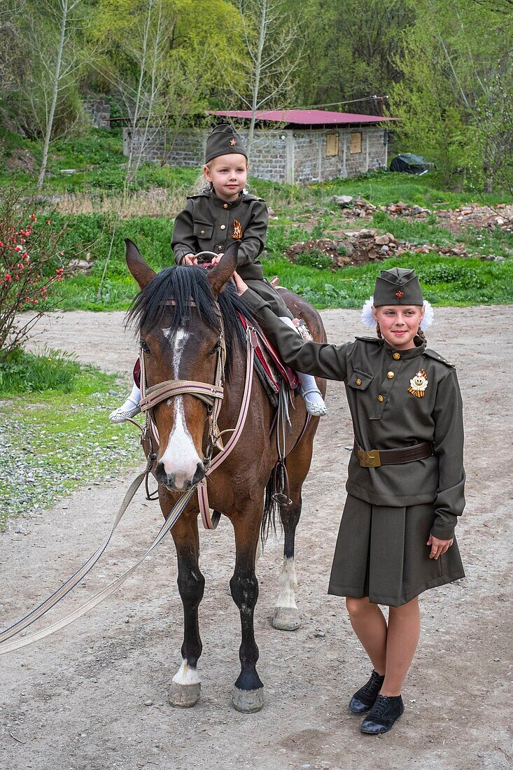 Armenia, Shirak region, Gyumri, children with Russian military uniform