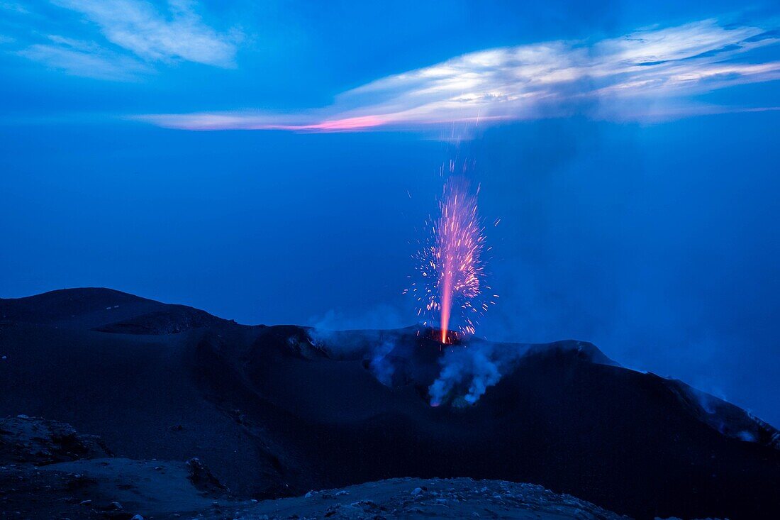 Italy, Sicily, Eolian Islands, Tyrrhenian sea, San Vincenzo, summit of Stromboli volcano 924 m, eruption of lava and projection of volcanic bombs from the central craters