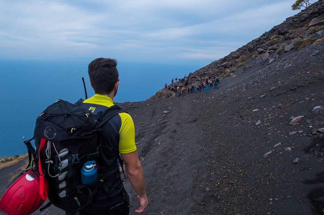 Italy, Sicily, Eolian Islands, Tyrrhenian sea, Stromboli volcano, San Vincenzo, ascent of the summit 924 m, facing the central crater