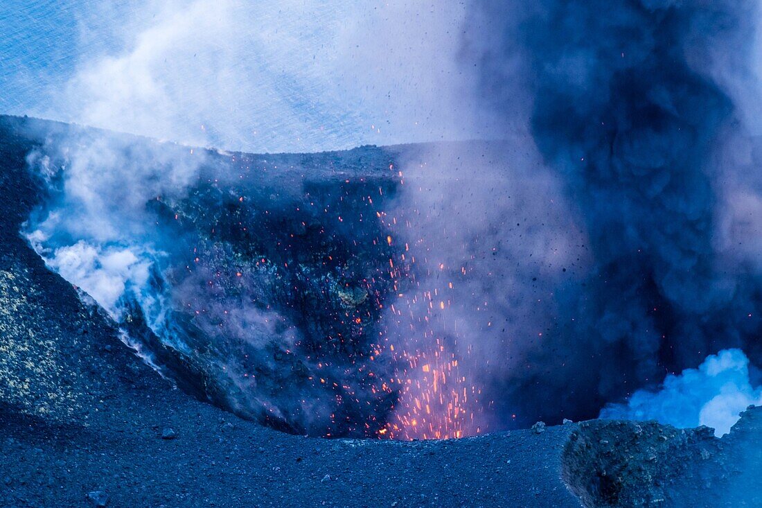 Italy, Sicily, Eolian Islands, Tyrrhenian sea, San Vincenzo, summit of Stromboli volcano 924 m, eruption of lava and projection of volcanic bombs from the central craters