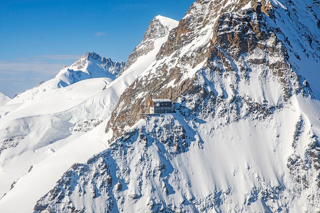 Switzerland, Canton of Bern, Bernese Oberland (highlands), Grindelwald, view to Jungfraufirn and Aletsch Glacier, part of Jungfrau Aletsch Bietschhorn UNESCO World Heritage Site and also called the Top of Europe (highest railway station in Europe), View to Sphinx Observatory (3571m) at mountain Sphinx near Jungfraujoch (3454m) (aerial view)