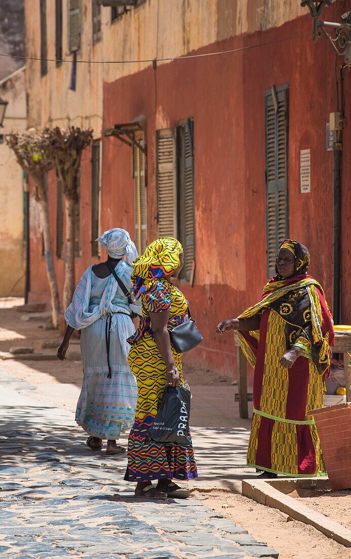 Senegal, Dakar, Goree Island, UNESCO World Heritage Site, women wearing traditional dresses