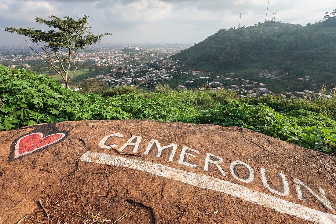 Cameroon, Centre Region, Mfoundi Department, Yaounde, Mount Febe, elevated view of Yaounde north western neighbourhoods with a Love Cameroon tag in the foreground