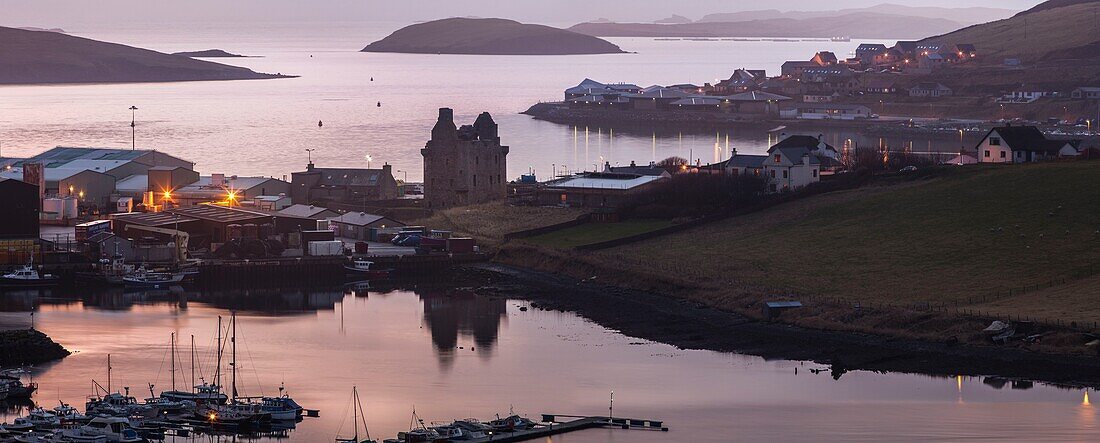 United Kingdom, Scotland, Shetland Islands, Mainland, Scalloway, elevated panoramic view of the harbour at sunset