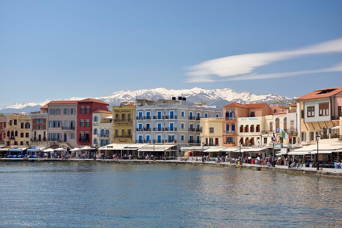 Greece, Crete, Chania, venetian port, pedestrian promenade with Lefká Óri or white mountains in the background