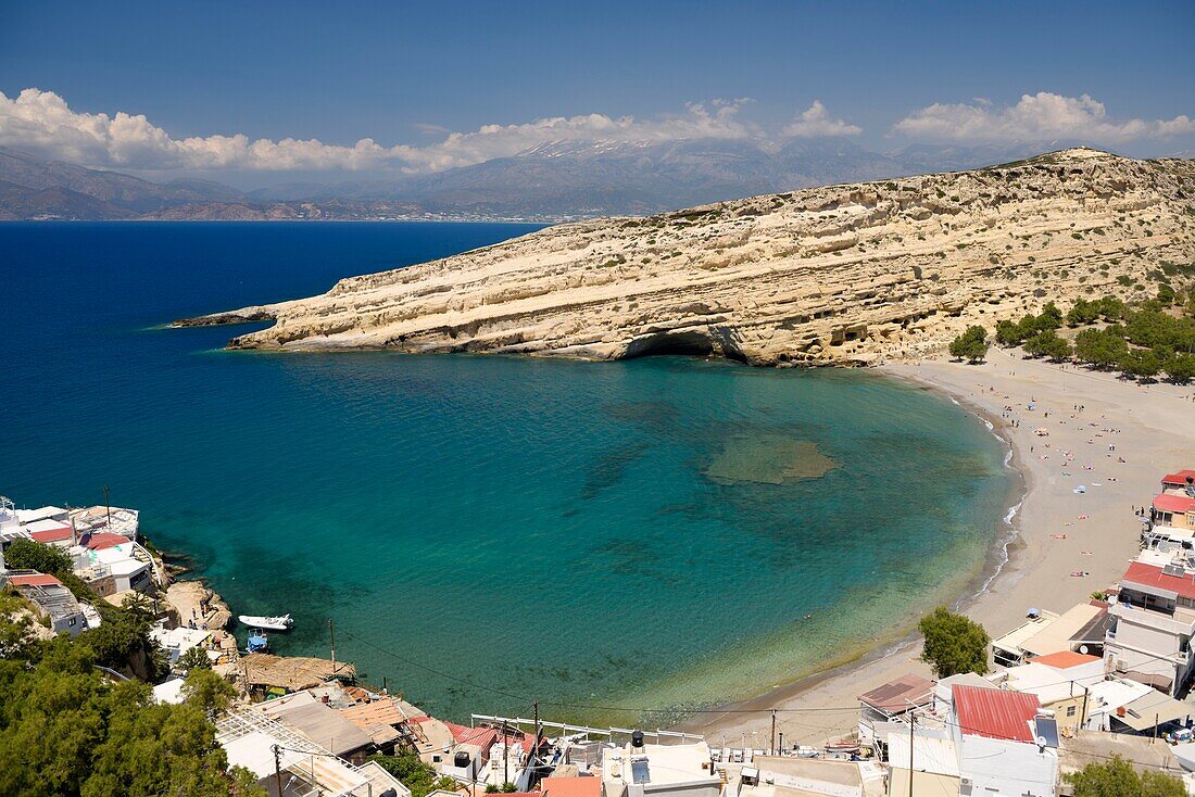 Greece, Crete, Matala, Matala Bay, beach and caves seen from the south cliff