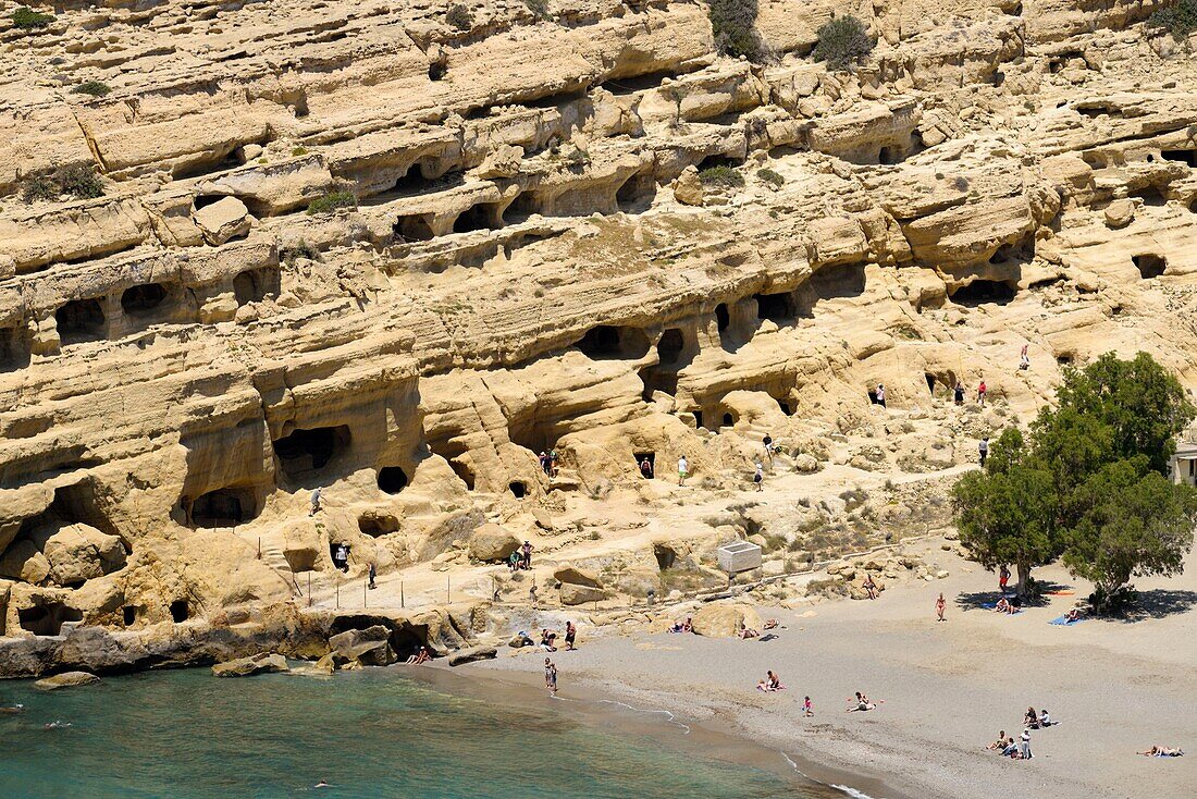 Greece, Crete, Matala, Matala Bay, beach and caves seen from the south cliff