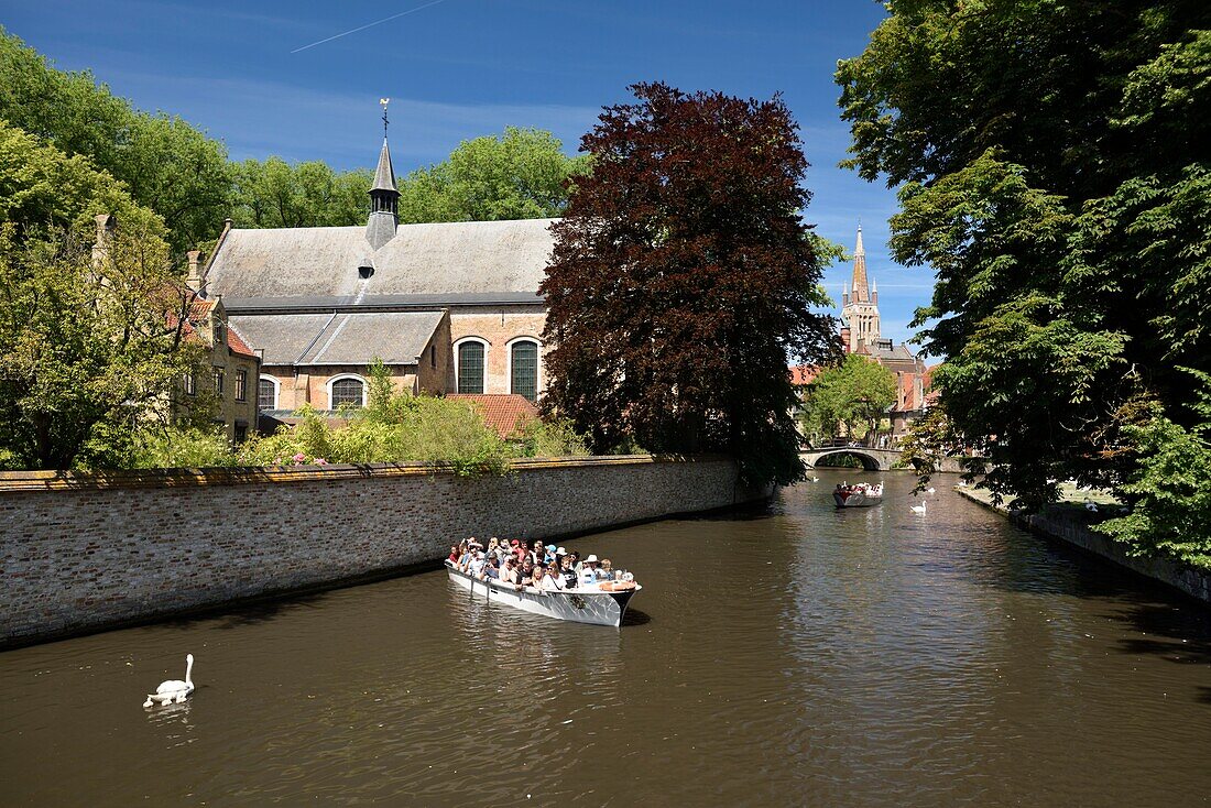 Belgium, West Flanders, Bruges, historical center listed as UNESCO World Heritage, Beguinage enclosure, canal along the Benedictine Monastery of the Vine or De Wijngaard dating from 1245, boat trip