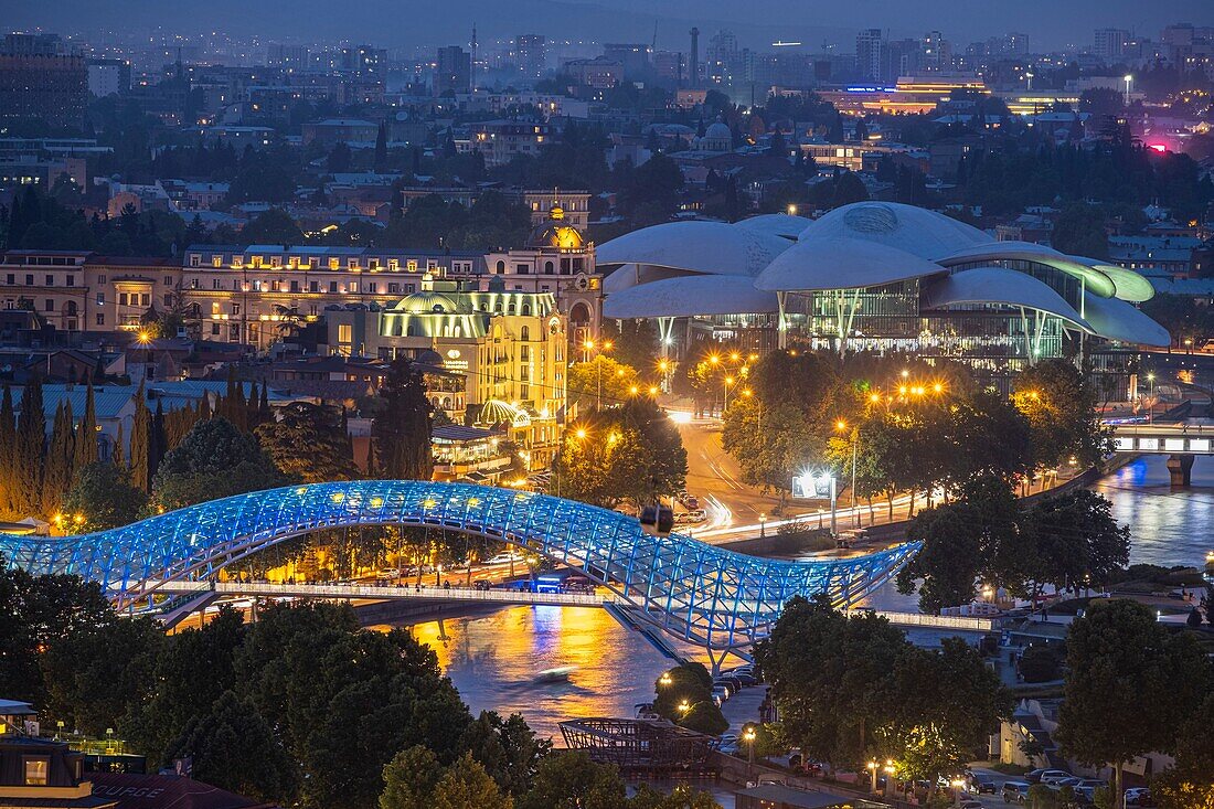 Georgia, Tbilisi, panorama over the city, Bridge of Peace over the Koura river and the Public Service Hall on the background