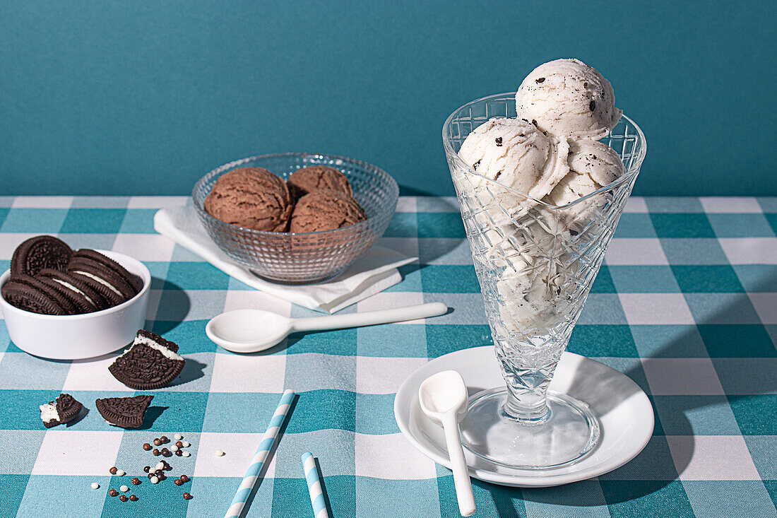 Crisp chocolate biscuits paired with creamy ice cream served in an elegant glass, perfect for a refreshing dessert scene