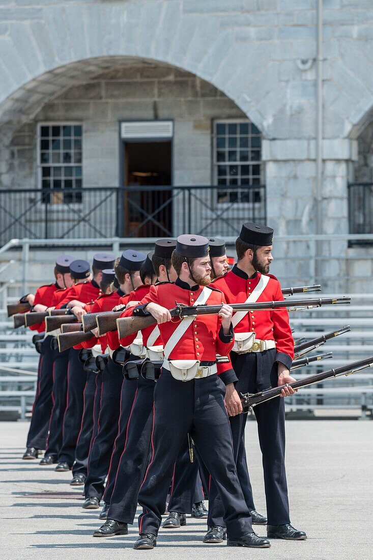 Canada, Ontario, Kingston along the St. Lawrence River, Rideau Canal and Lake Ontario, comedians in costume at Fort Henry