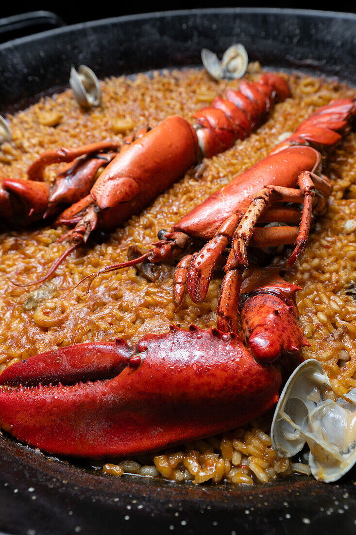 A perfectly cooked Valencian seafood paella with mussels, crab, squid, and a beautifully developed socarrat.