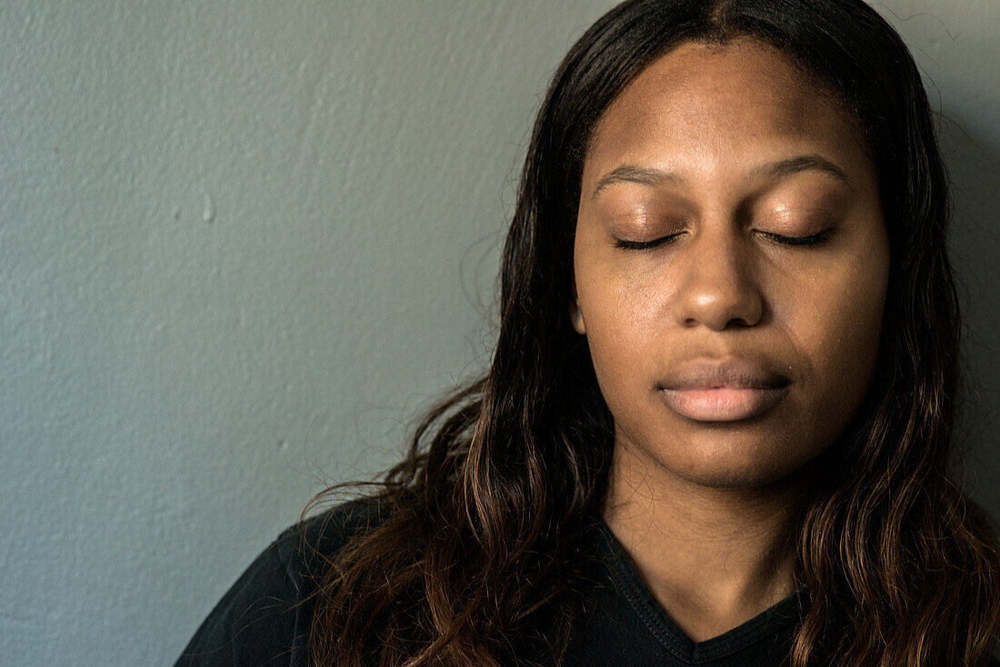 Studio Portrait of a Young Adult, Colored Woman born in the Caribbean. Tilburg, Netherlands.