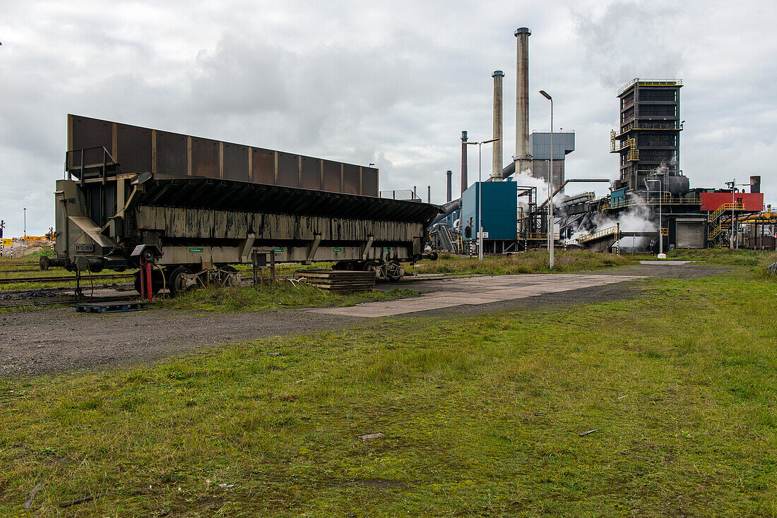 Huge, heavy steel production plant and industry terrain, producing various kinds of steel inside an CO2 Emitting and Exhausting Factory. IJmuiden, Netherlands.