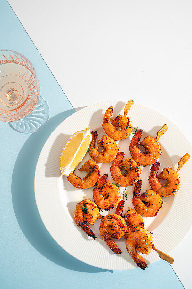 BBQ Shrimp with a slice of lemon on a summer backdrop