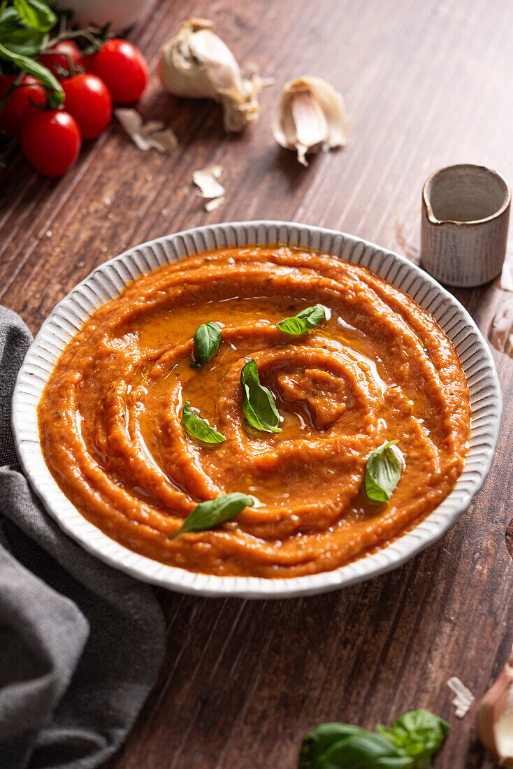 Bowl of tomato sauce and fresh ingredients