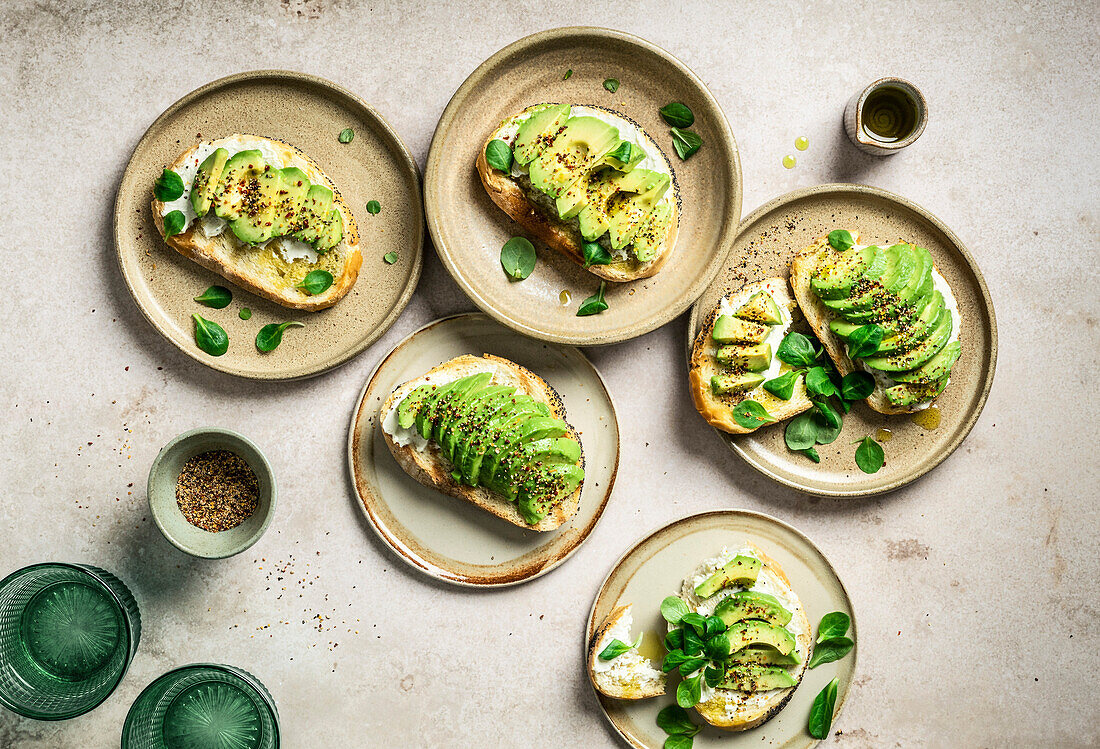 Avocado toast breakfast scene on light background