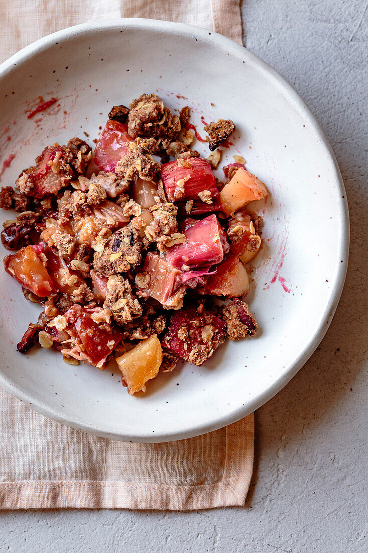 Apple and rhubarb crumble in a bowl