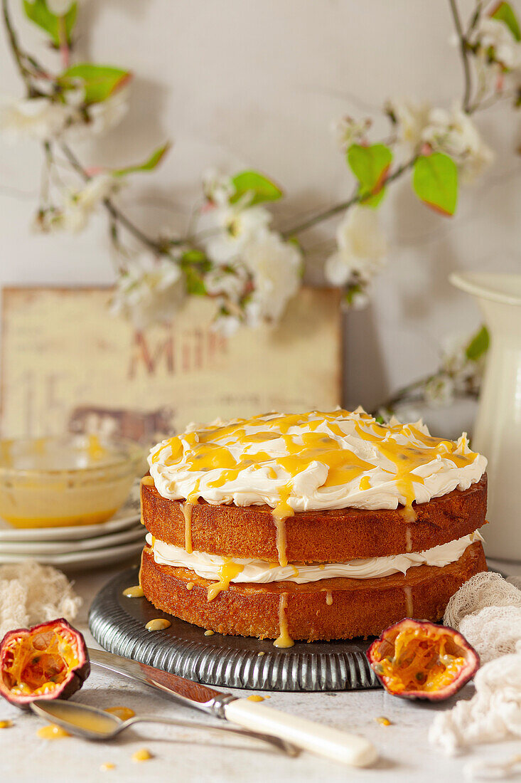 A passion fruit cake with mascarpone cream icing, passion fruit quark and passion fruit coulis.