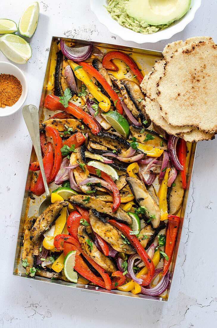 Portobello mushroom and bell pepper fajitas with avocado and tortillas