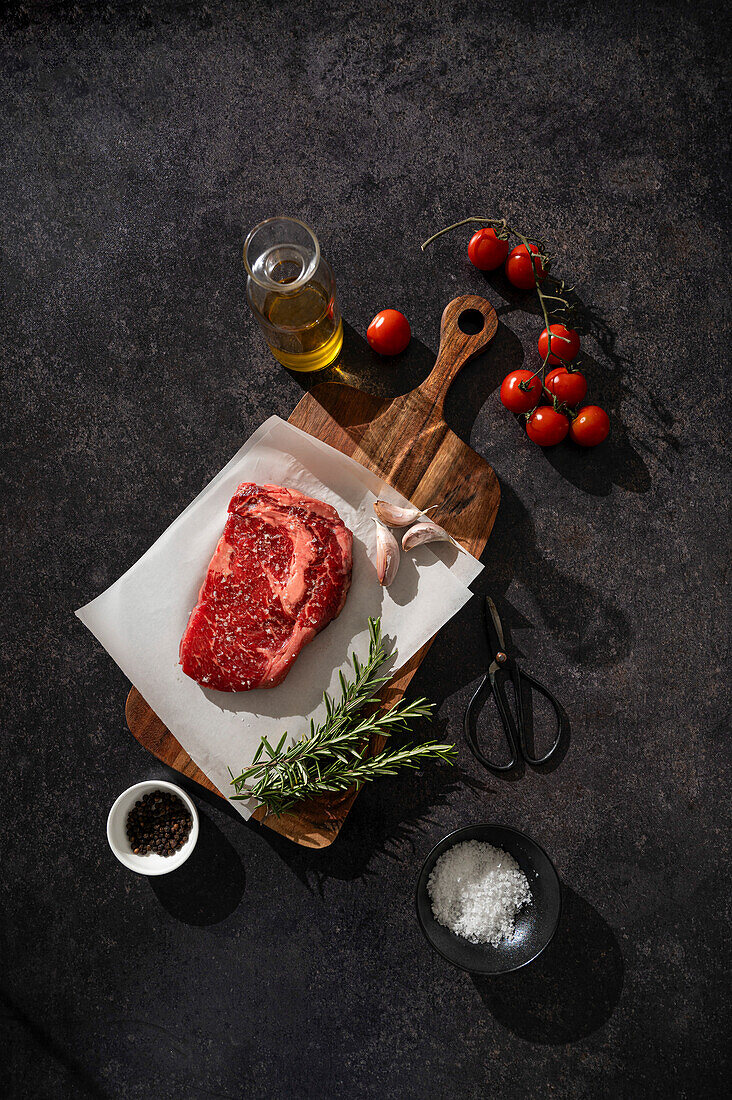 Raw steak on a black background