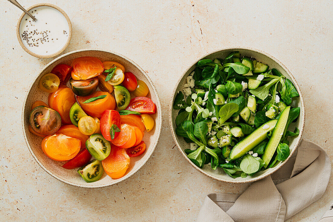 Tomato and cucumber salad in soft light on a stone background