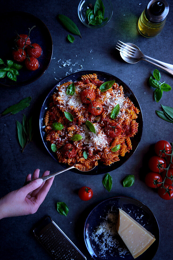 High-protein vegetable pasta made from red lentils with roasted tomatoes and basil.