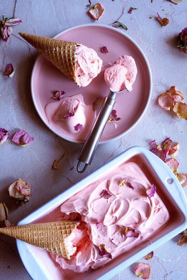 Rose blossom ice cream. Melting ice cream with cones of waffles.