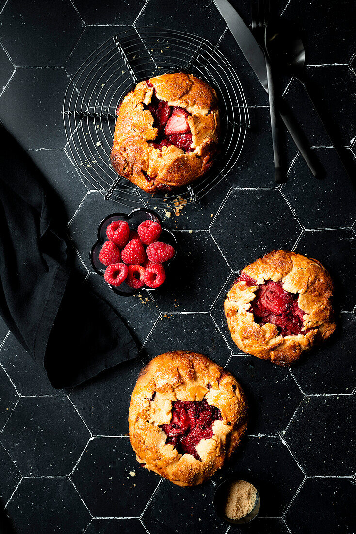 Raspberry galletes on black background