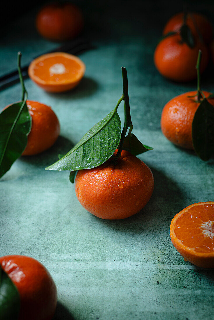 Clementines on a green background