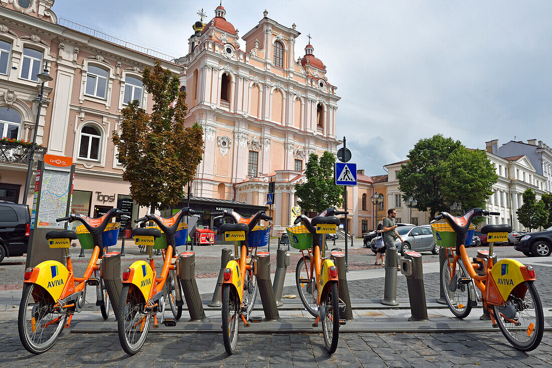 Bike self-service station in front of the Church of St. Casimir, Vilnius, Lithuania, Europe