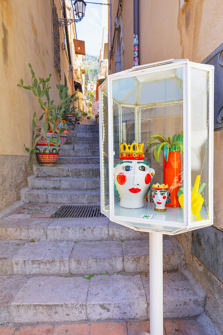 Old town alley filled with artwork and ceramic pots, Taormina, Sicily, Italy, Mediterranean, Europe