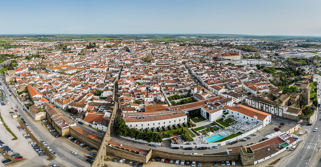 Aerial drone panoramic view of the historic Centre of Evora, a city with roots in Roman times, with its golden age in the 15th century when the residence of the Portuguese kings, Evora, Alentejo, Portugal, Europe